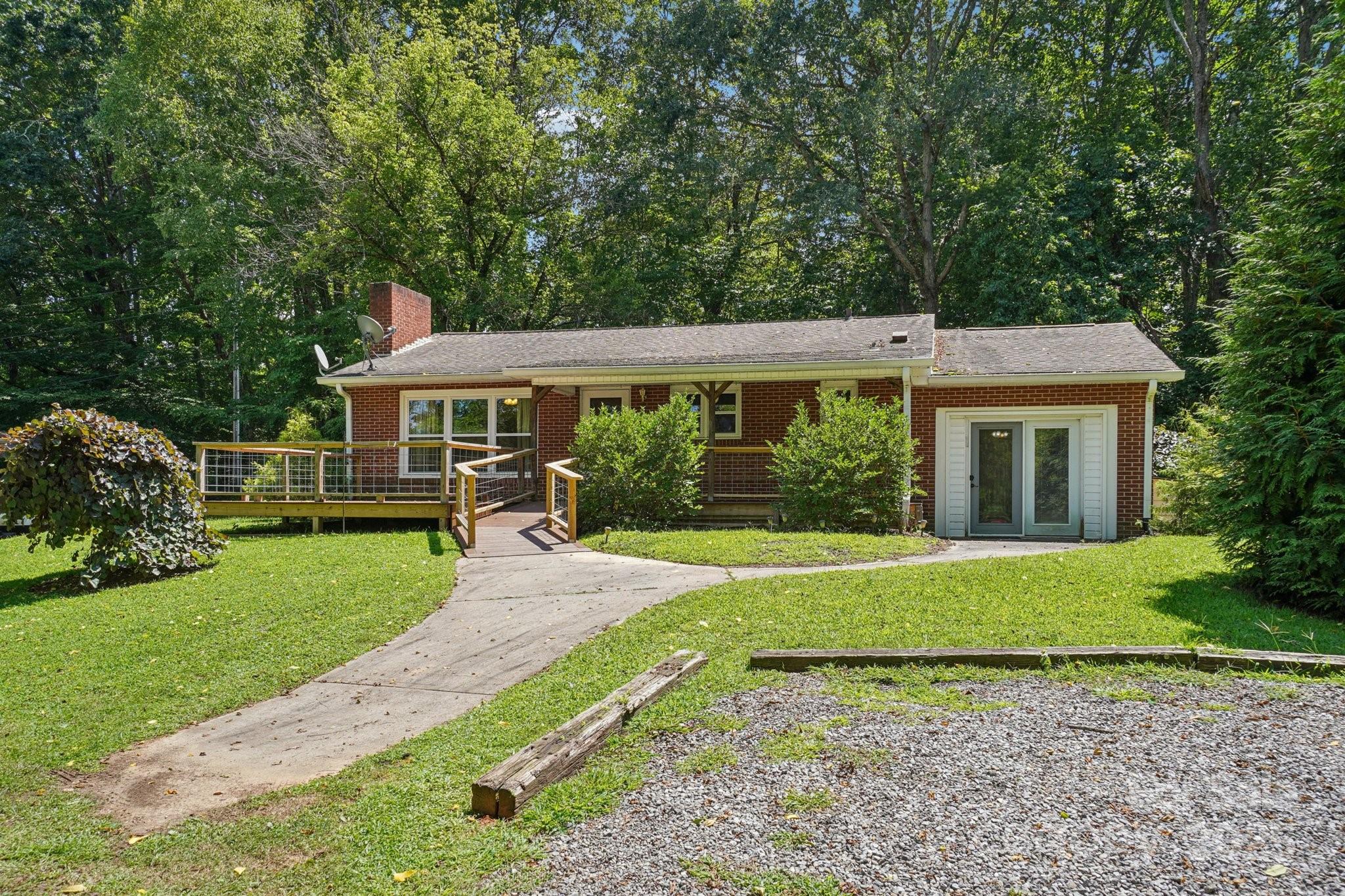 623 Edwards Cove Road Waynesville, NC 28786 - Photo 2 of 46 a front view of a house with a yard