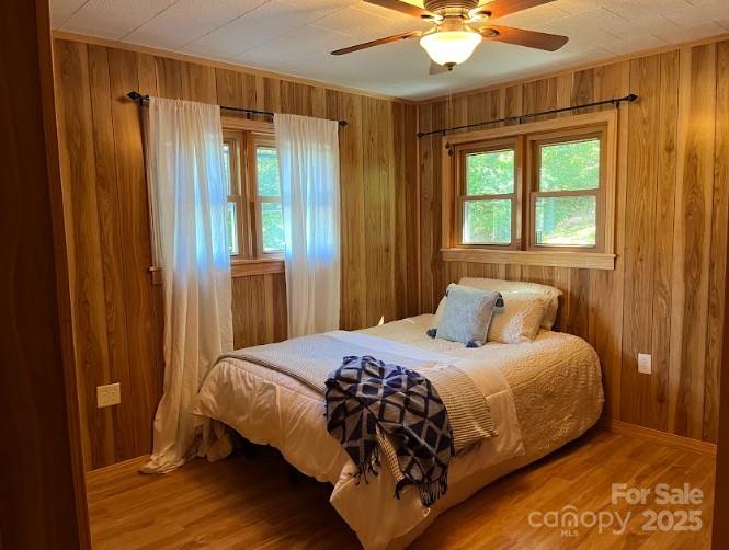 623 Edwards Cove Road Waynesville, NC 28786 - Photo 21 of 46 a bedroom with a bed and a window