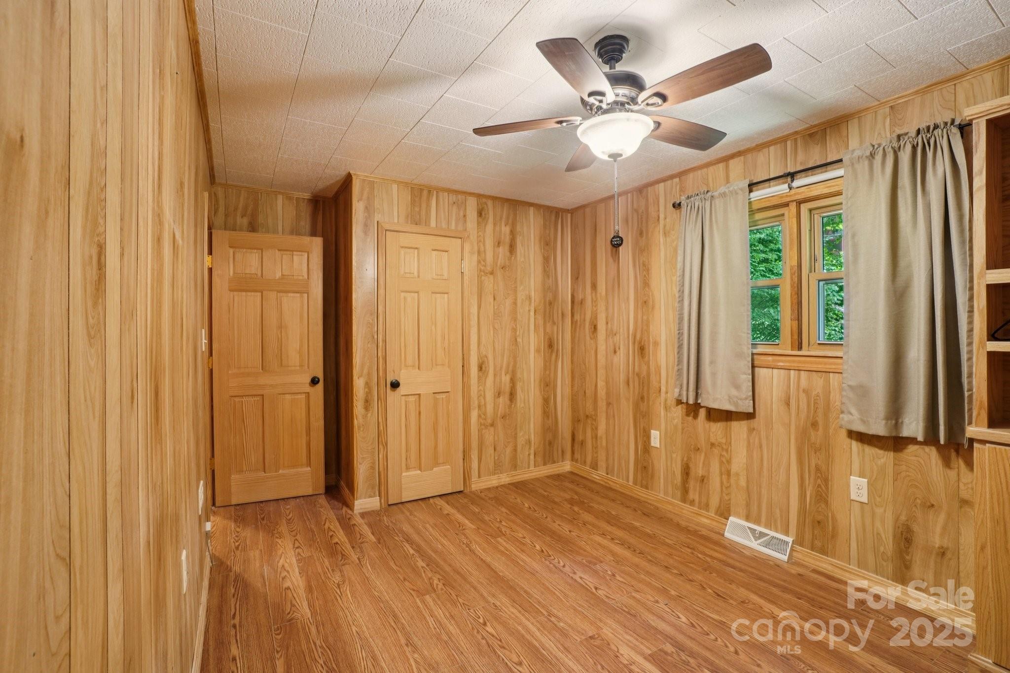 623 Edwards Cove Road Waynesville, NC 28786 - Photo 24 of 46 a view of an empty room with a window