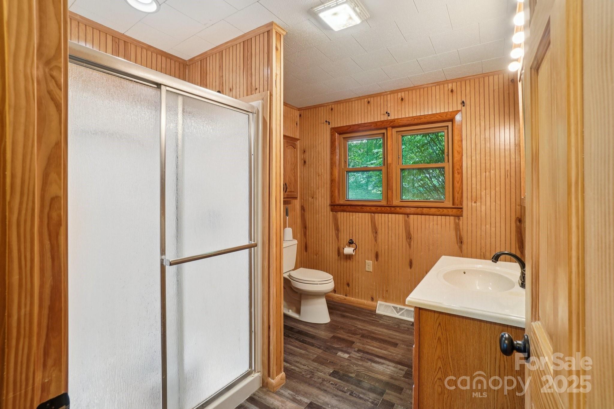 623 Edwards Cove Road Waynesville, NC 28786 - Photo 28 of 46 a bathroom with a granite countertop sink toilet and shower