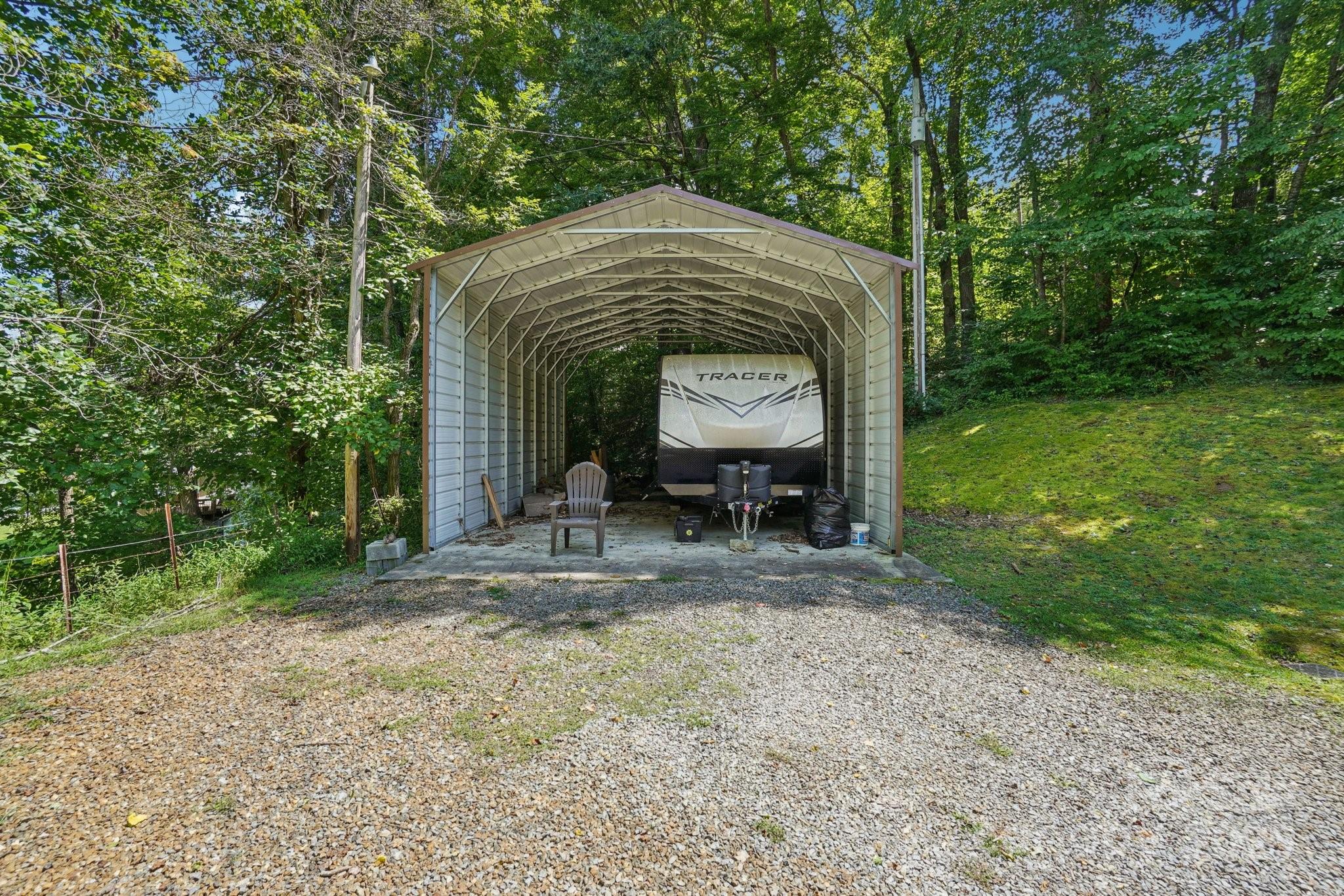 623 Edwards Cove Road Waynesville, NC 28786 - Photo 38 of 46 a house view with a garden space