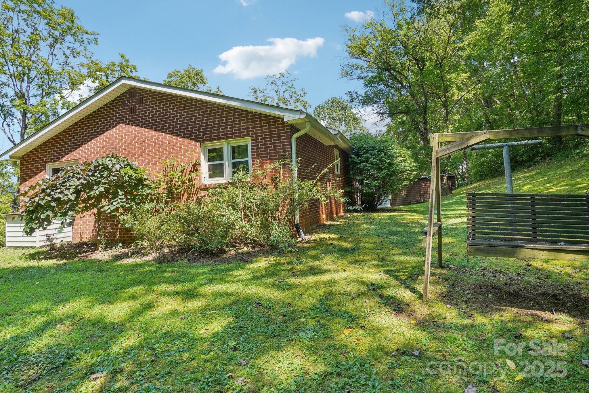 623 Edwards Cove Road Waynesville, NC 28786 - Photo 42 of 46 a view of a house with backyard