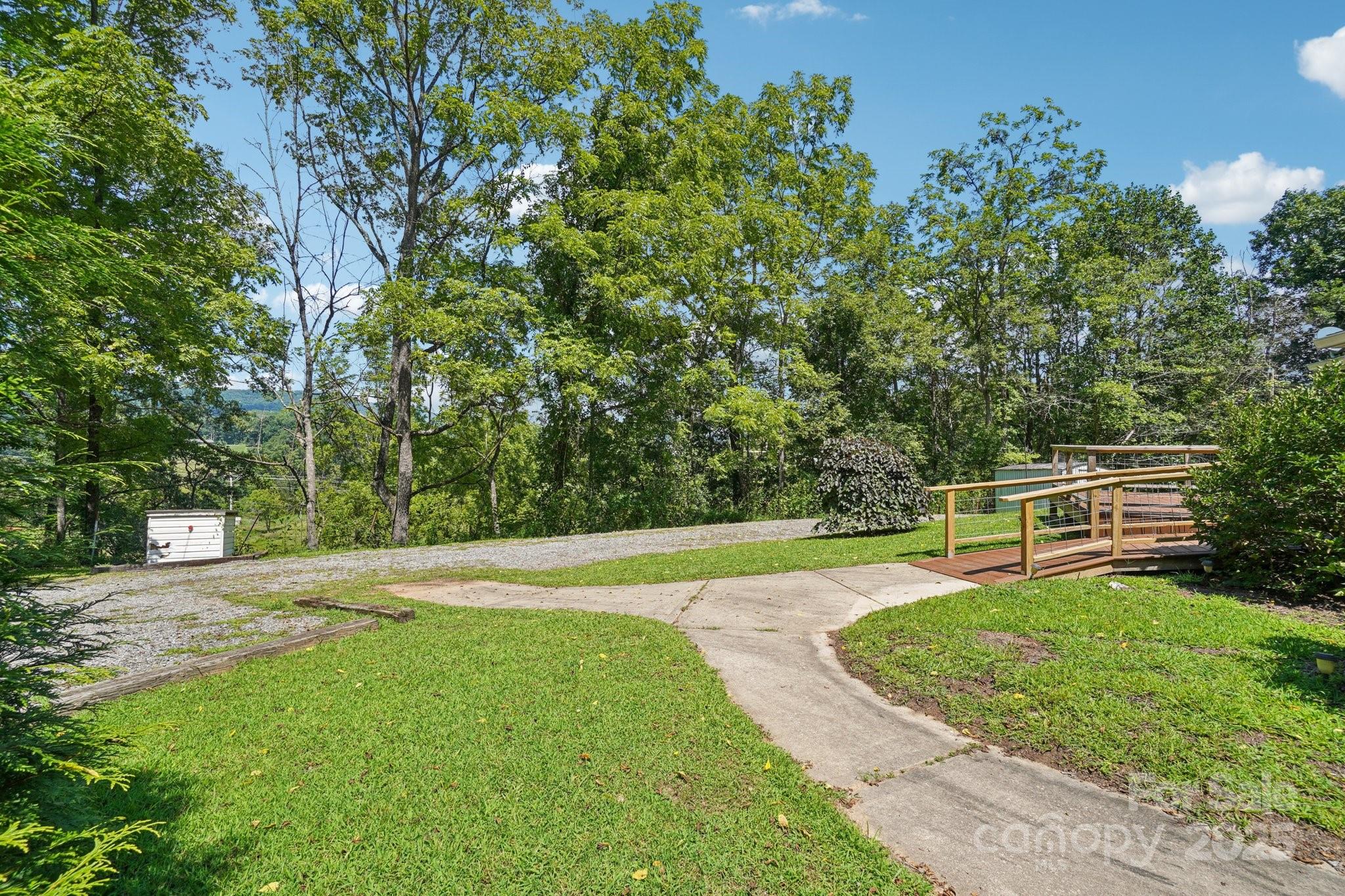 623 Edwards Cove Road Waynesville, NC 28786 - Photo 43 of 46 a view of a backyard with a garden