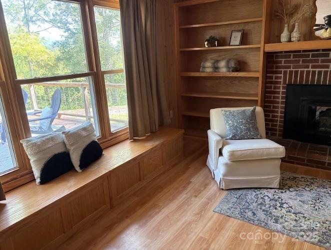 623 Edwards Cove Road Waynesville, NC 28786 - Photo 6 of 46 a living room with furniture and a fireplace