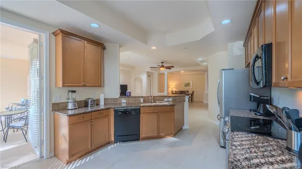 a kitchen with lots of counter top space and sink