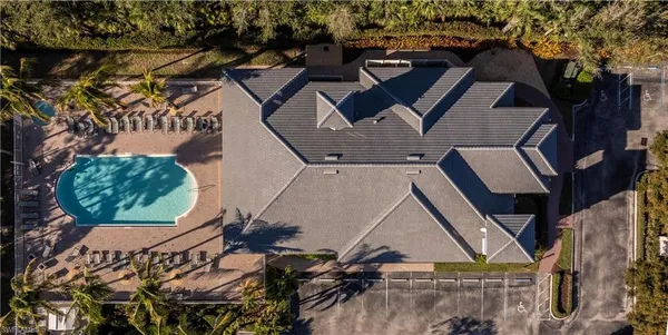 an aerial view of a residential apartment building with a yard