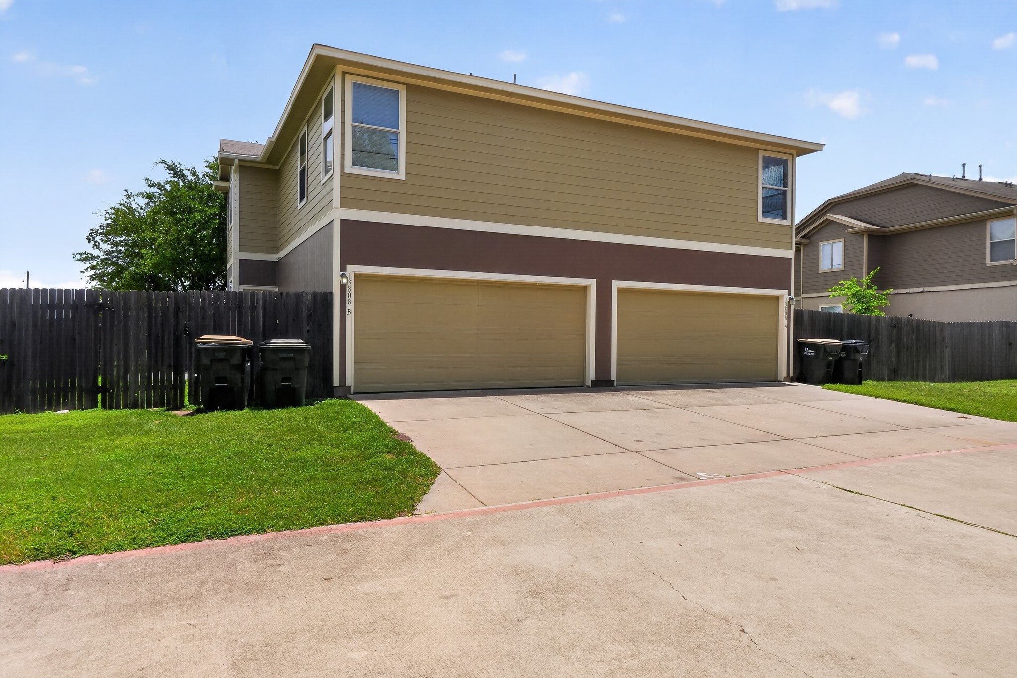 13808 Harris Ridge Boulevard Pflugerville, TX 78660 - Photo 6 of 40 a front view of a house with a yard and a garage