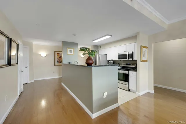 a kitchen with granite countertop a sink and a stove top oven
