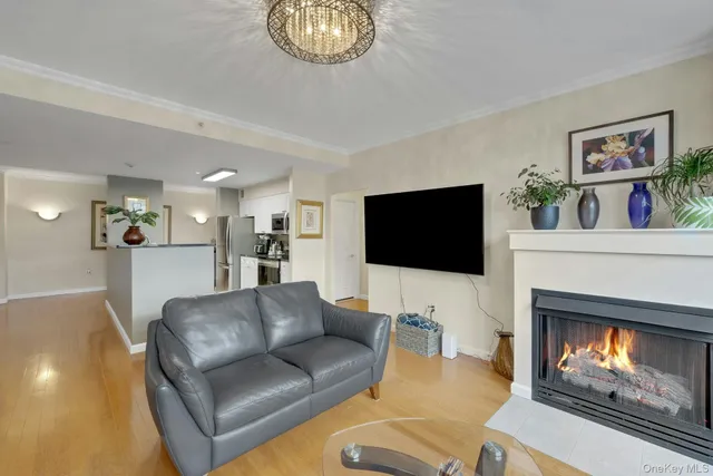 a kitchen view with stainless steel appliances a refrigerator and a stove top oven
