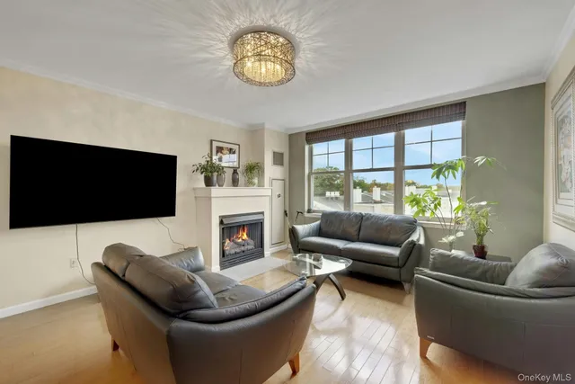 a view of a living room kitchen and a flat screen tv