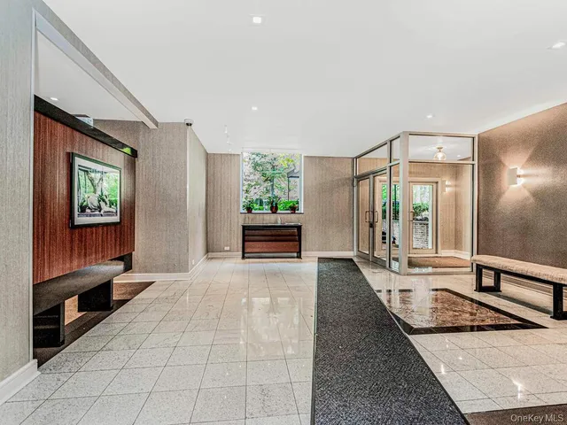 a view of a brick house with a yard