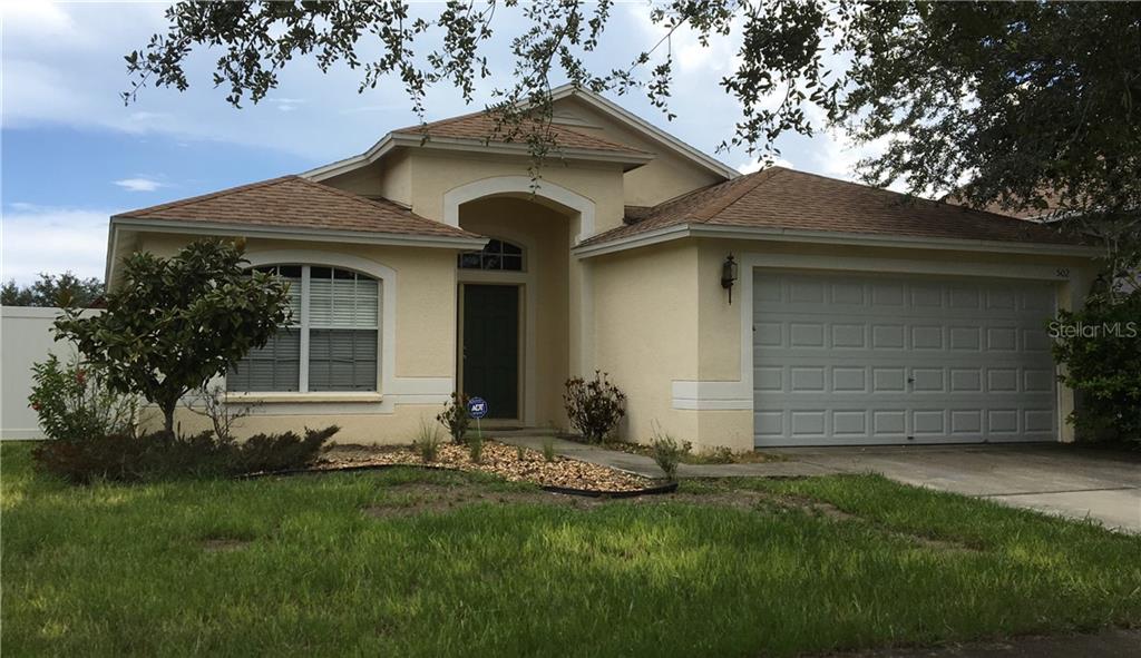 502 Caribe Ridge Way Ruskin, FL 33570 - Photo 1 of 1 a front view of a house with a yard