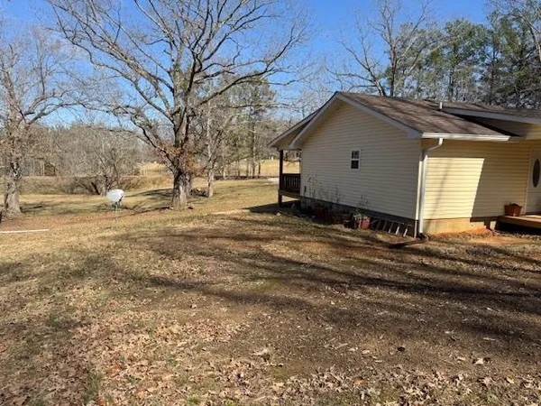a view of a house with a snow in the yard