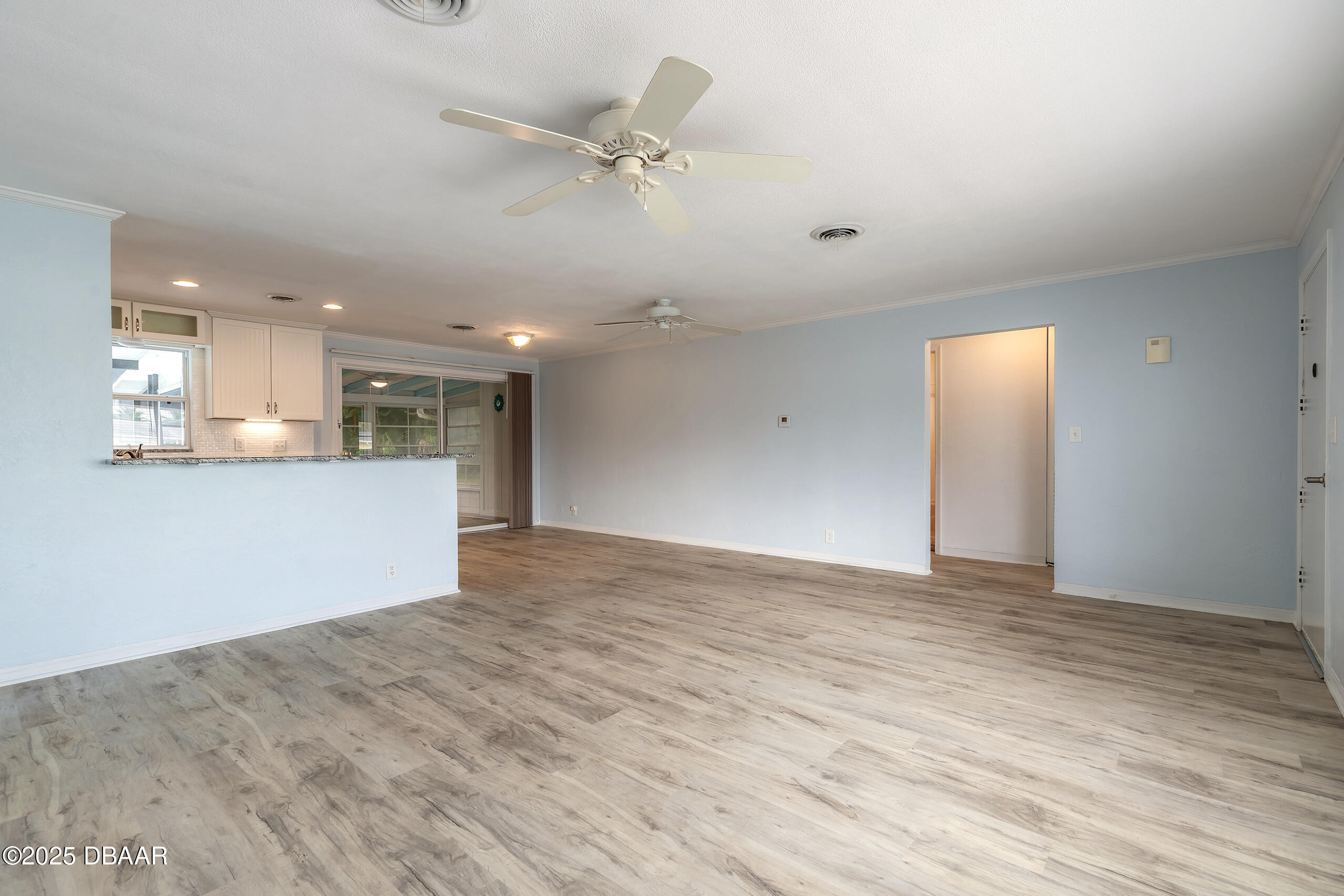 45 Rivocean Drive Ormond Beach, FL 32176 - Photo 11 of 37 a view of a kitchen with a dishwasher and a refrigerator