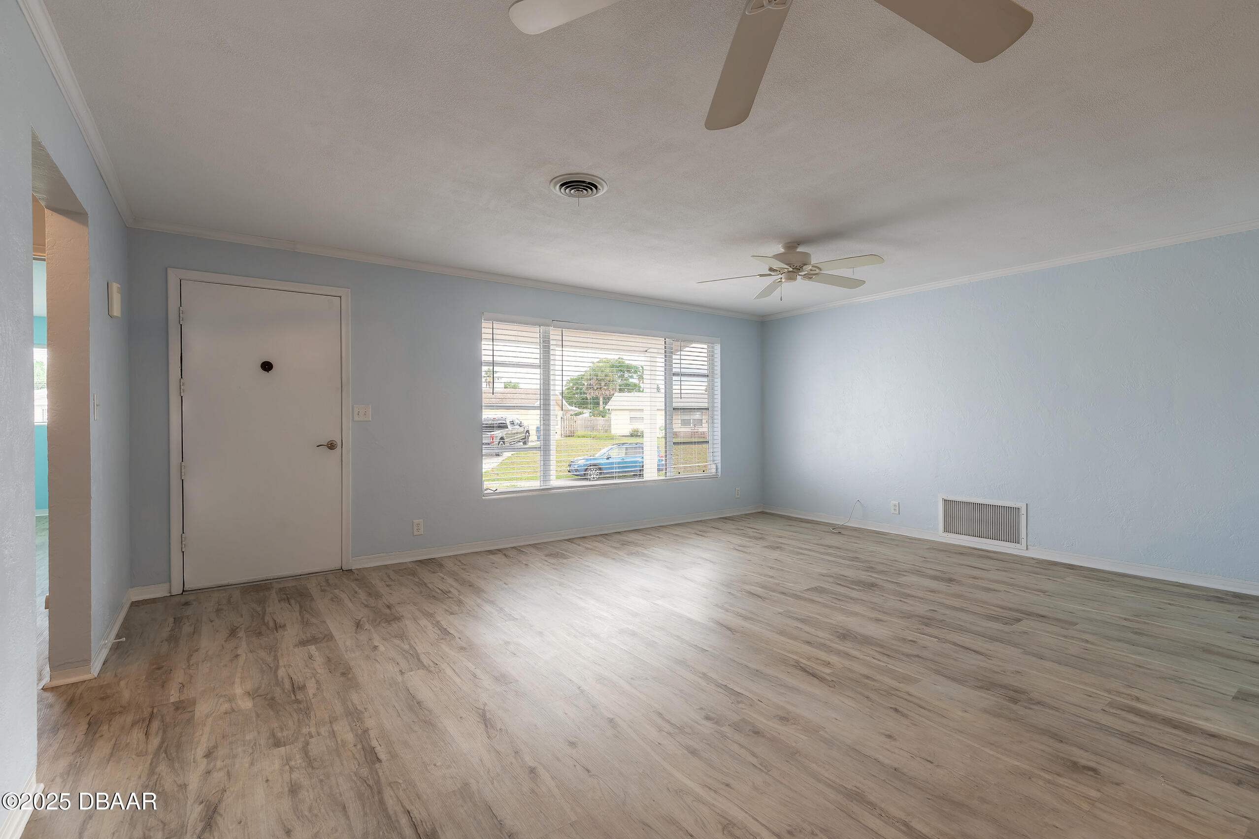 45 Rivocean Drive Ormond Beach, FL 32176 - Photo 13 of 37 an empty room with wooden floor and windows