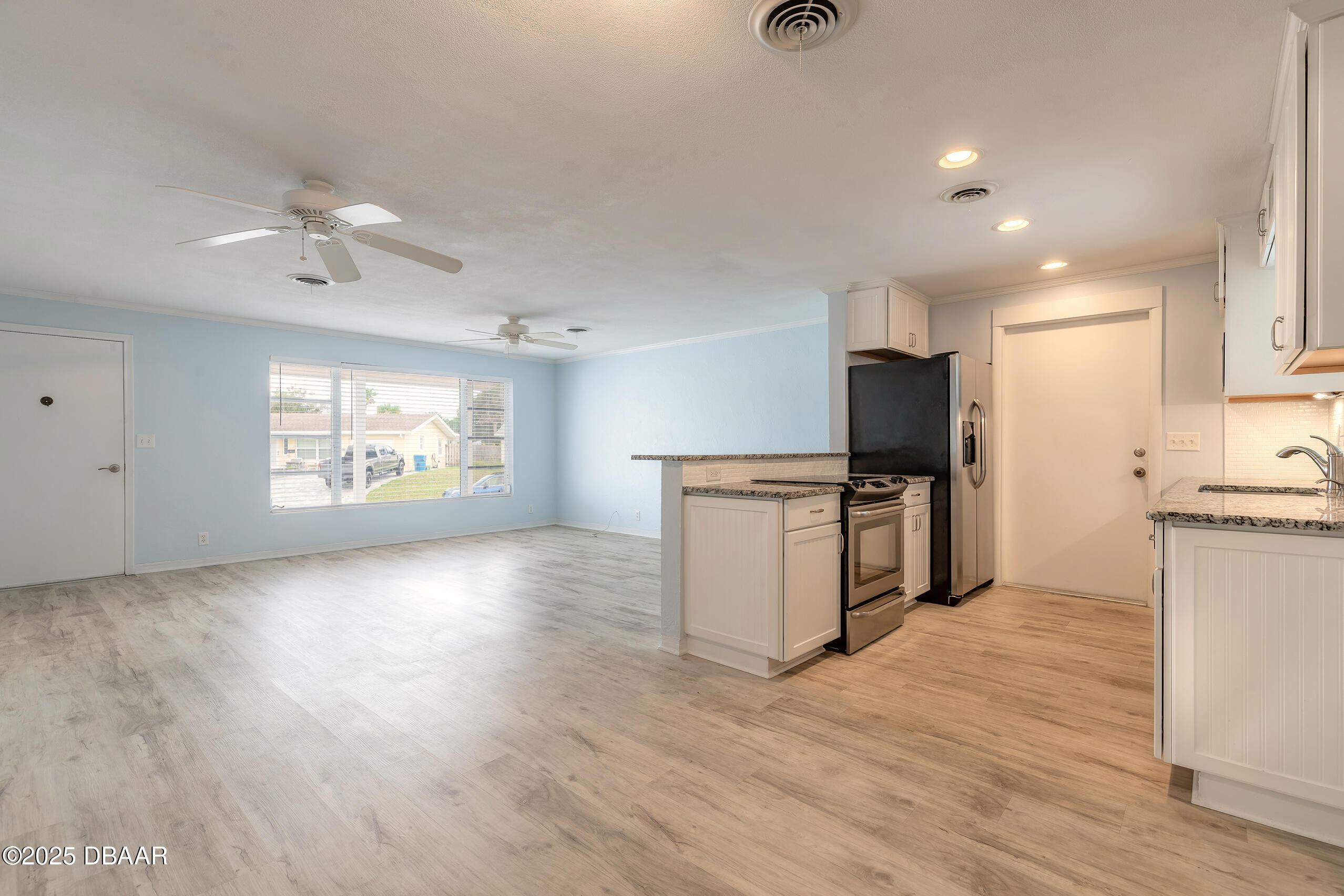 45 Rivocean Drive Ormond Beach, FL 32176 - Photo 15 of 37 a view of kitchen with sink microwave and refrigerator