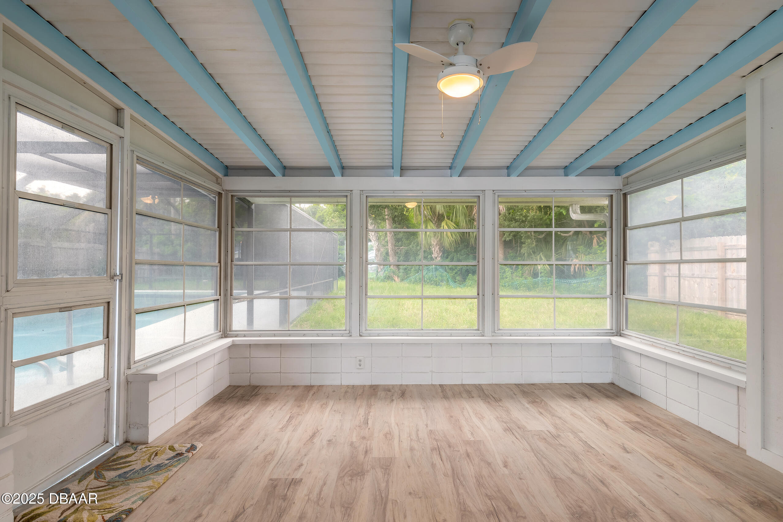 45 Rivocean Drive Ormond Beach, FL 32176 - Photo 20 of 37 a view of an empty room with wooden floor and a window