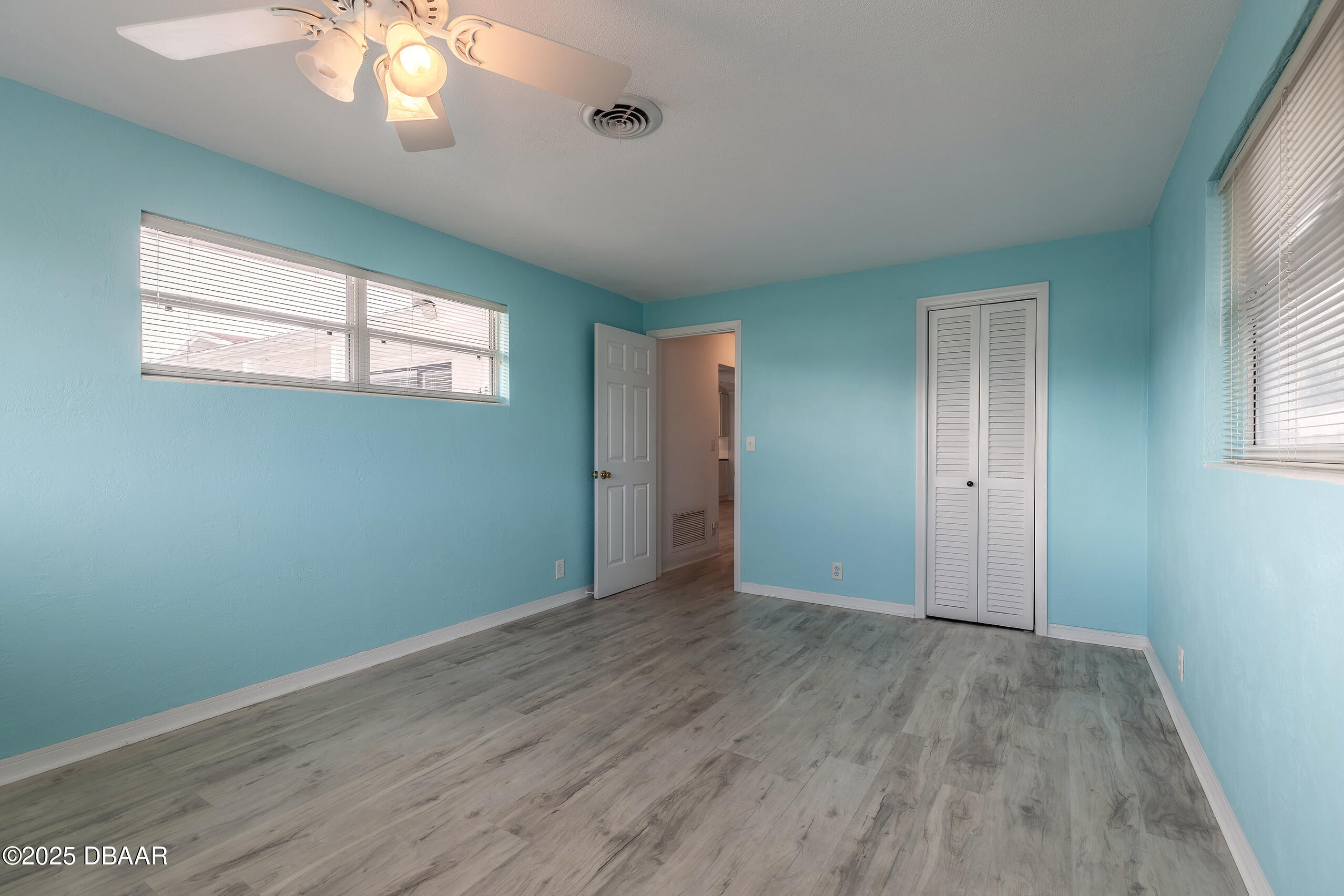 45 Rivocean Drive Ormond Beach, FL 32176 - Photo 5 of 37 an empty room with wooden floor and windows
