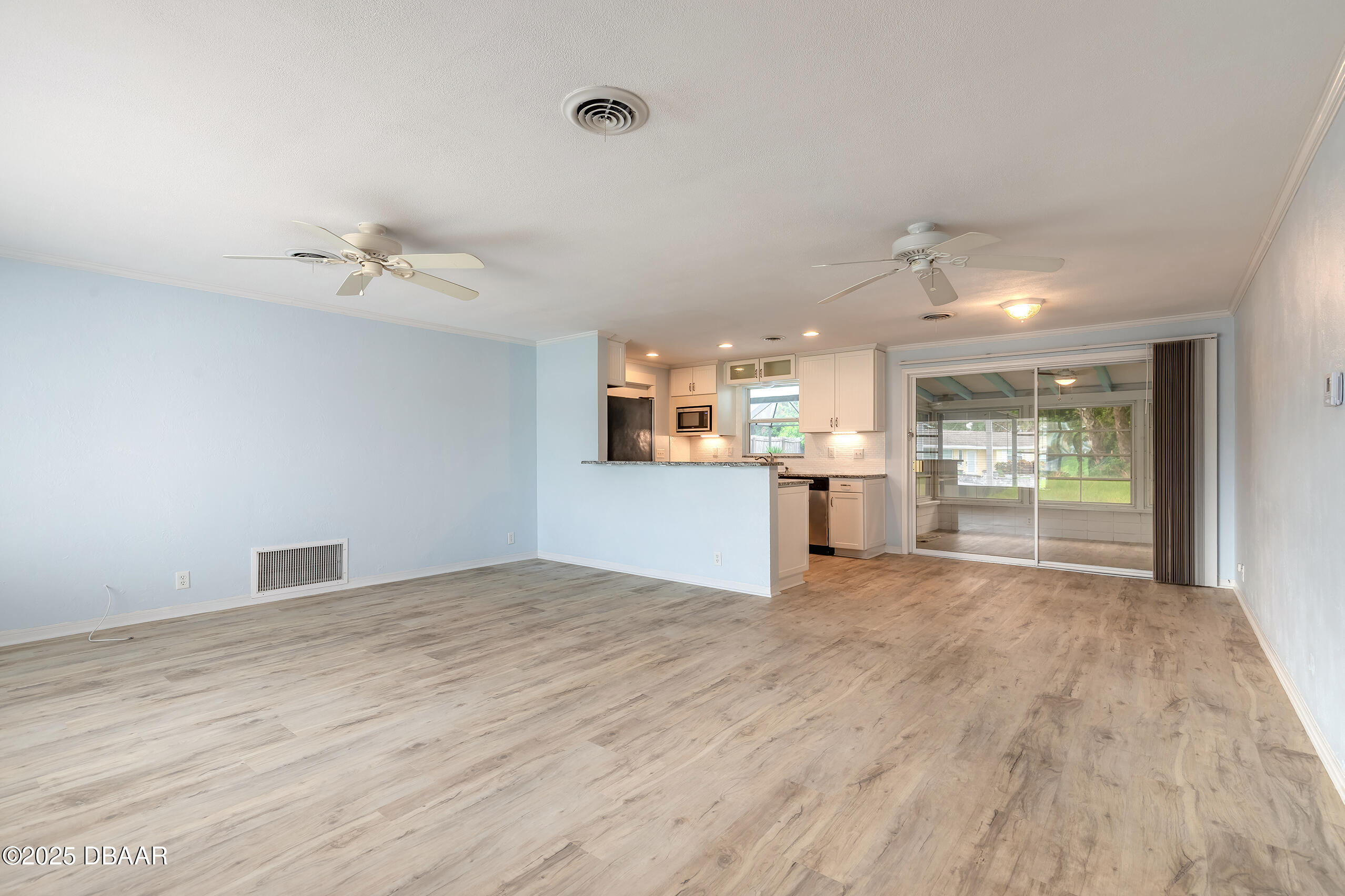 45 Rivocean Drive Ormond Beach, FL 32176 - Photo 10 of 37 a view of an empty room with a kitchen