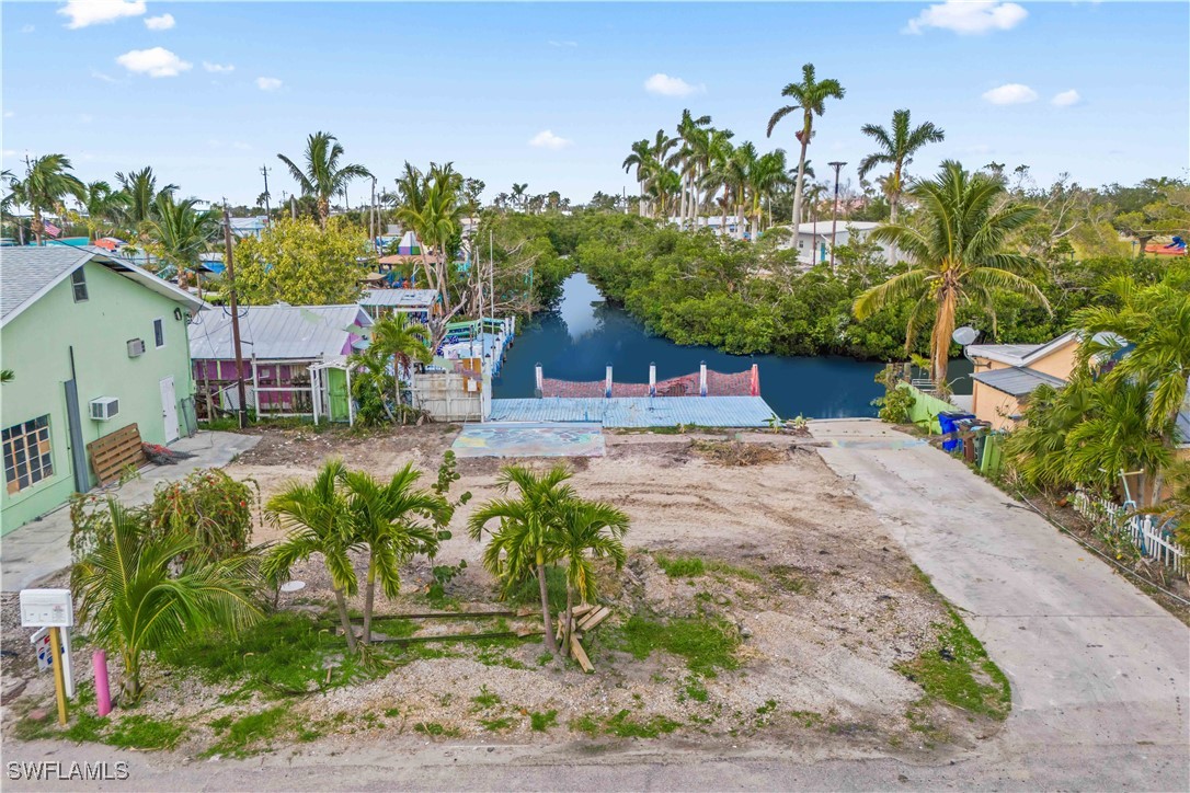 11306 Matlacha Avenue Matlacha, FL 33993 - Photo 3 of 11 a view of a yard and an fountain