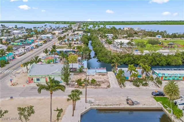 an aerial view of a house with a garden and pool