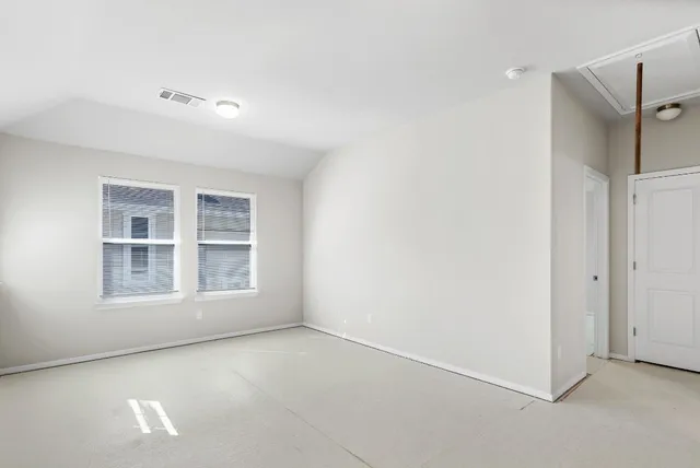 a view of empty room with windows