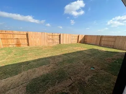 a view of a living room and kitchen