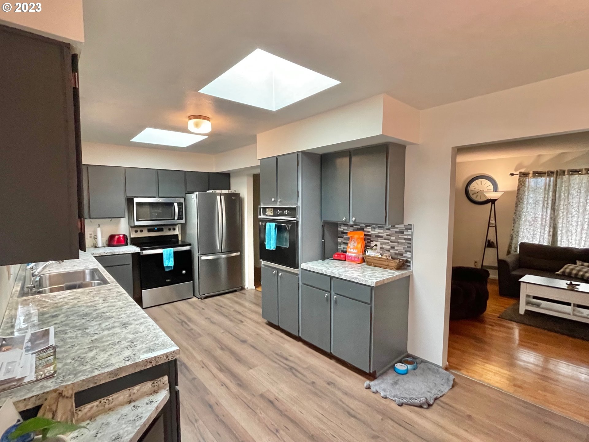 2113 Austin Road Roseburg, OR 97471 - Photo 11 of 36 a kitchen view with wooden floor and electronic appliances
