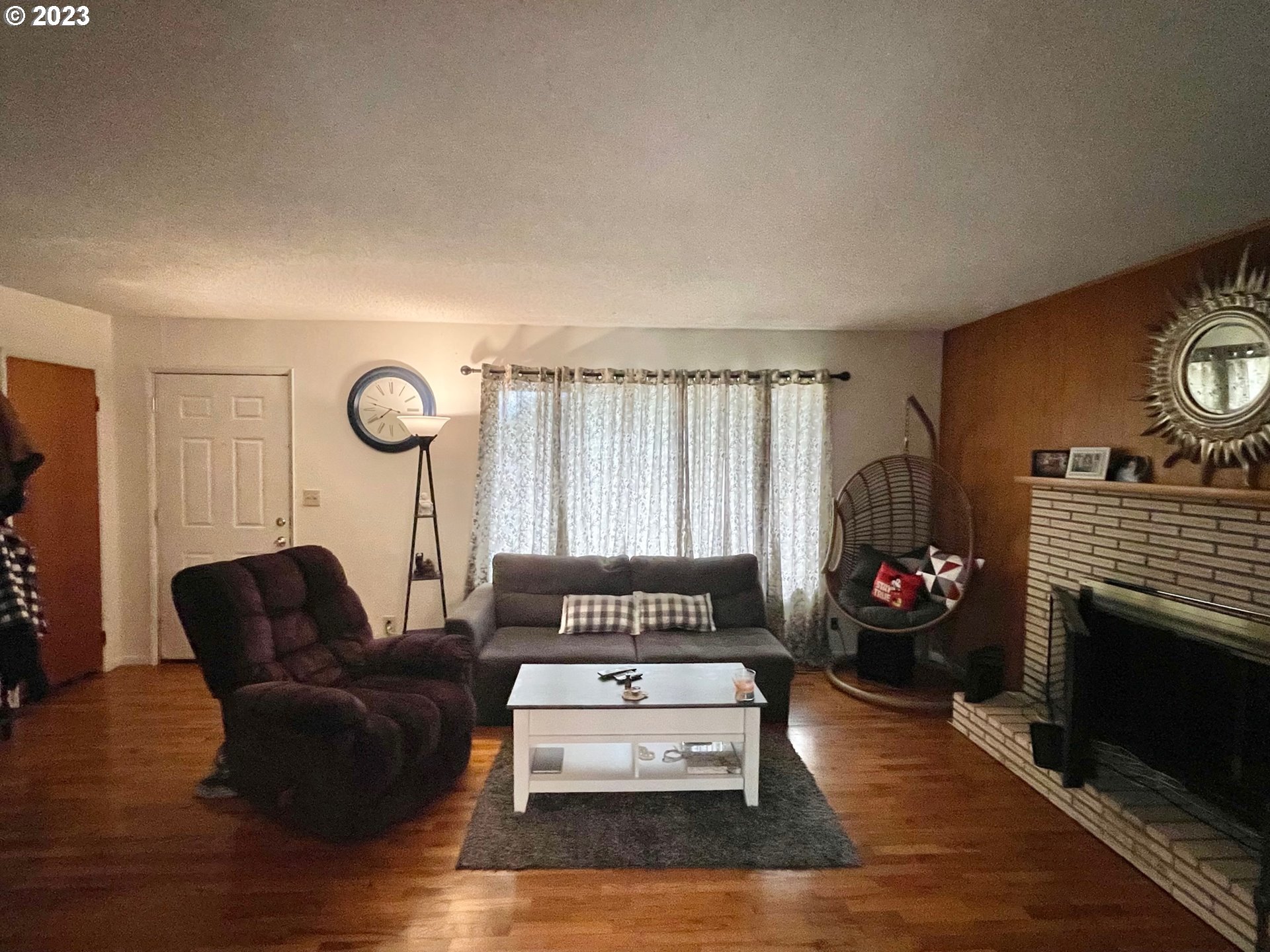 2113 Austin Road Roseburg, OR 97471 - Photo 6 of 36 a living room with furniture a fireplace and a window