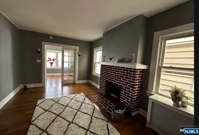a view of a hardwood floor and wardrobe