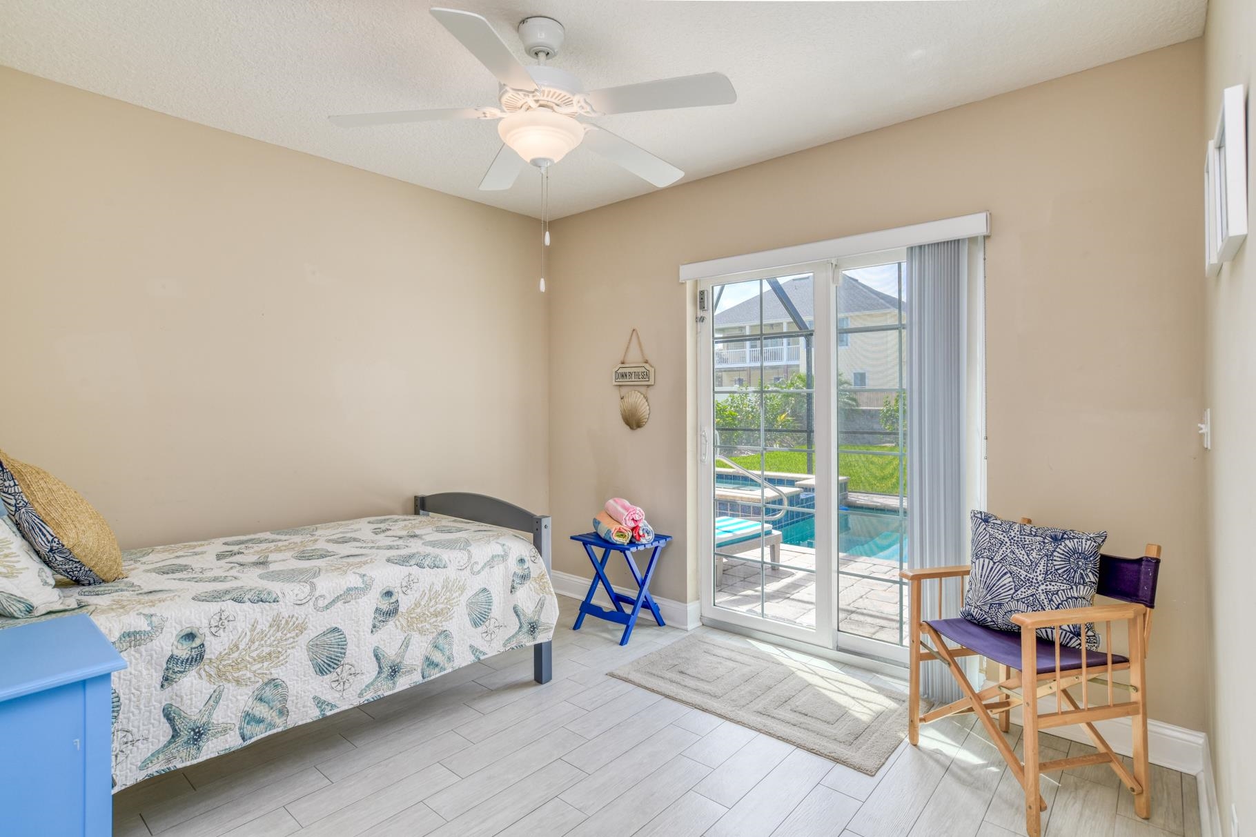 5067 Atlantic View St. Augustine, FL 32080 - Photo 11 of 47 a bedroom with a bed and a chandelier