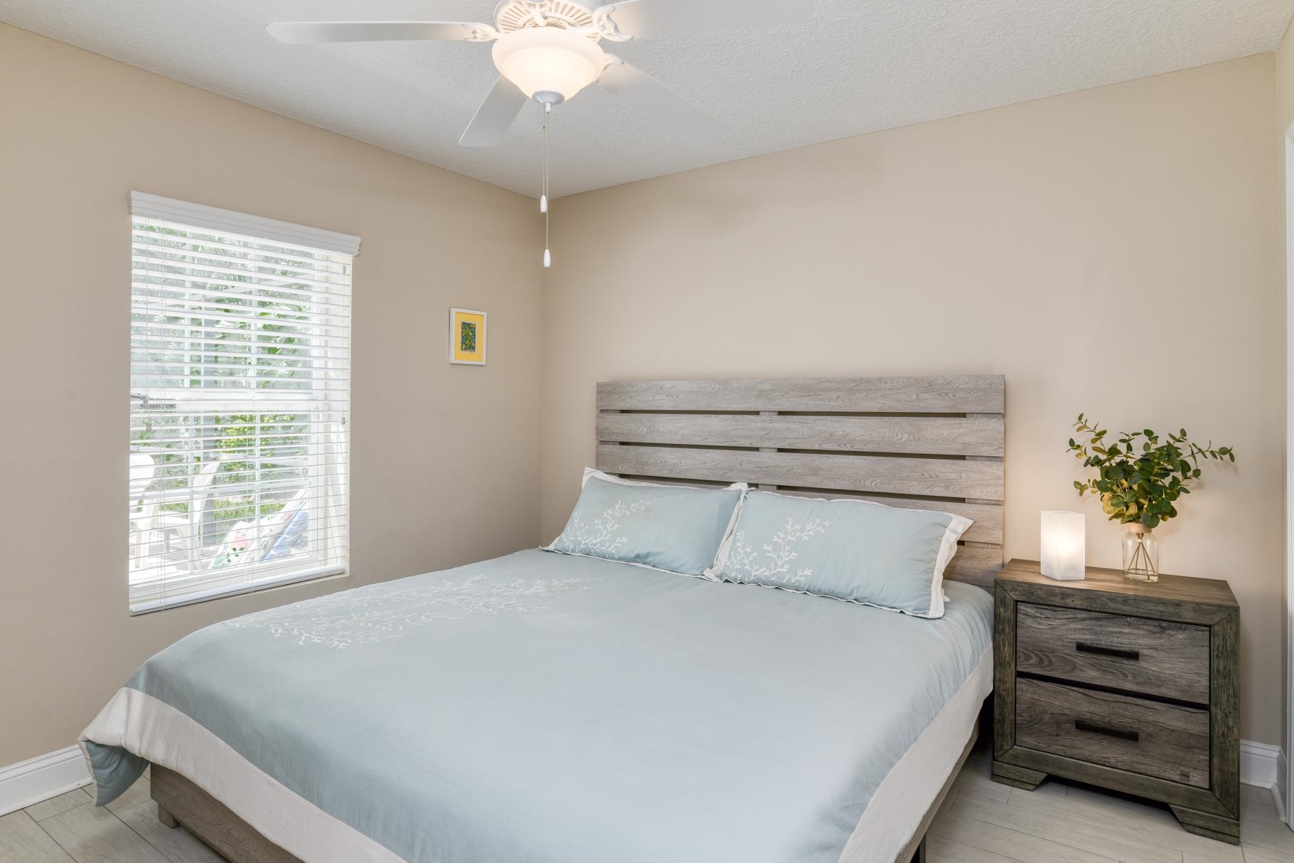 5067 Atlantic View St. Augustine, FL 32080 - Photo 14 of 47 a bedroom with a bed and a potted plant
