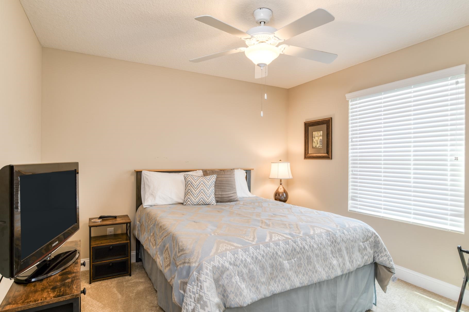 5067 Atlantic View St. Augustine, FL 32080 - Photo 20 of 47 a bedroom with a bed and a flat screen tv
