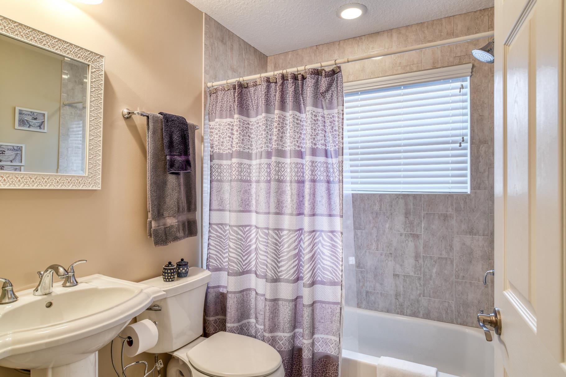 5067 Atlantic View St. Augustine, FL 32080 - Photo 21 of 47 a bathroom with a sink toilet and shower