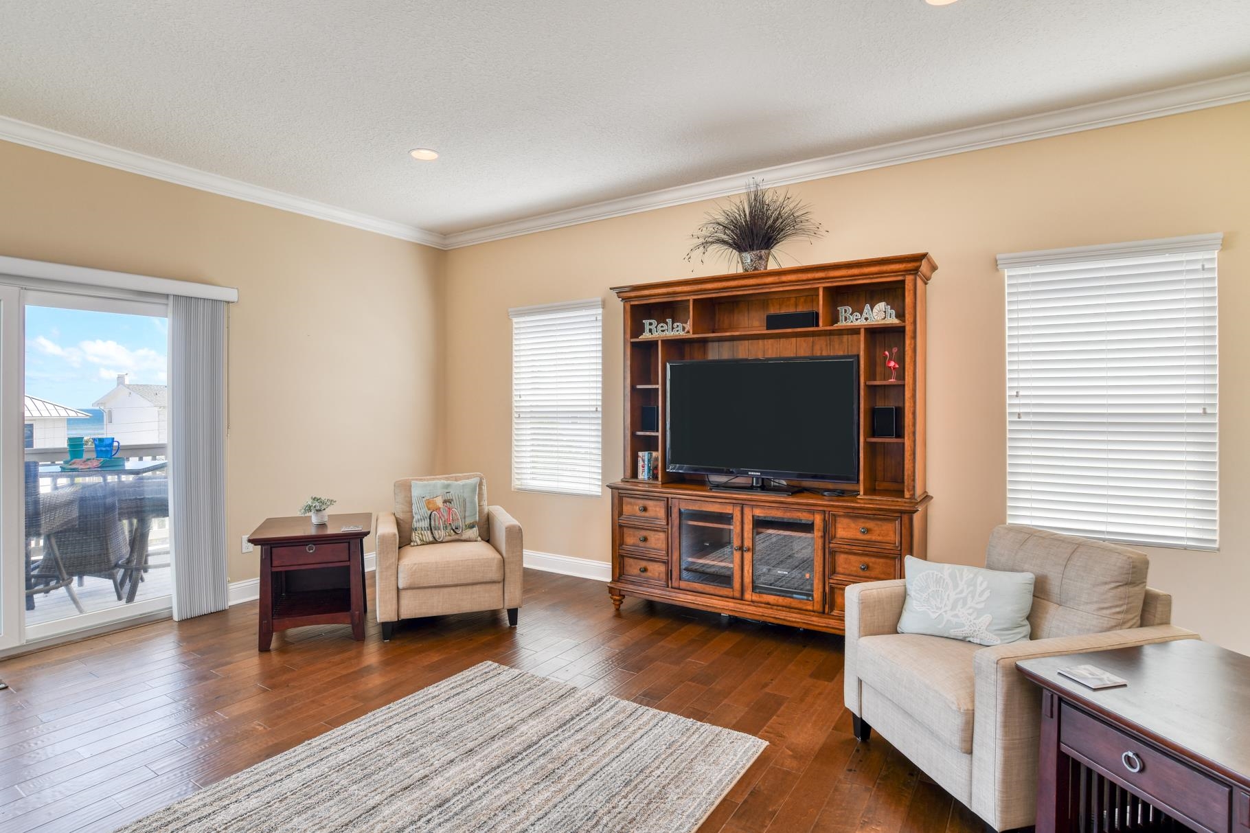 5067 Atlantic View St. Augustine, FL 32080 - Photo 25 of 47 a living room with furniture and a flat screen tv