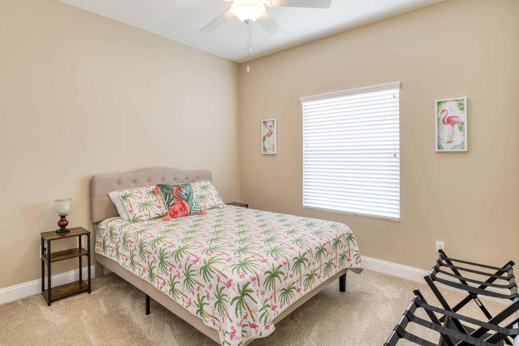 5067 Atlantic View St. Augustine, FL 32080 - Photo 34 of 47 a bedroom with a bed and a chandelier