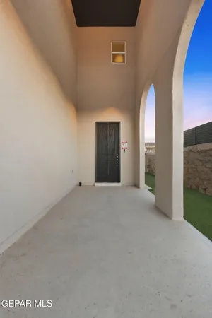 a view of an empty room with a cabinet