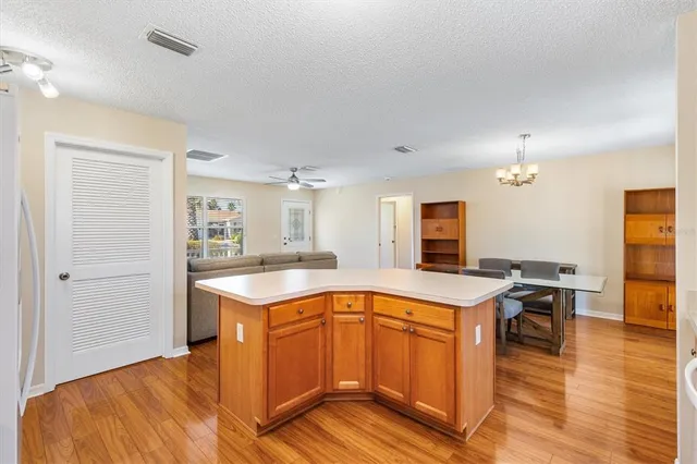 a kitchen with a stove and a refrigerator