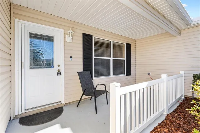 a view of a chair and bench in the backyard