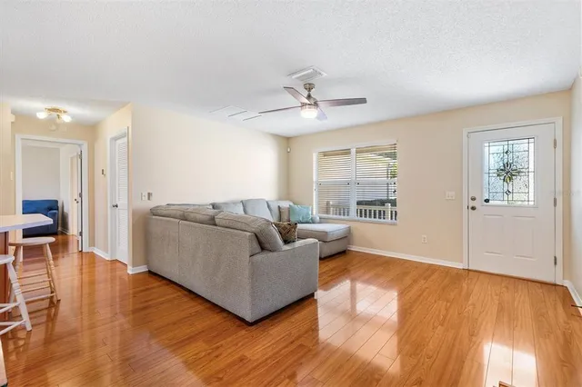 a living room with furniture and a large window