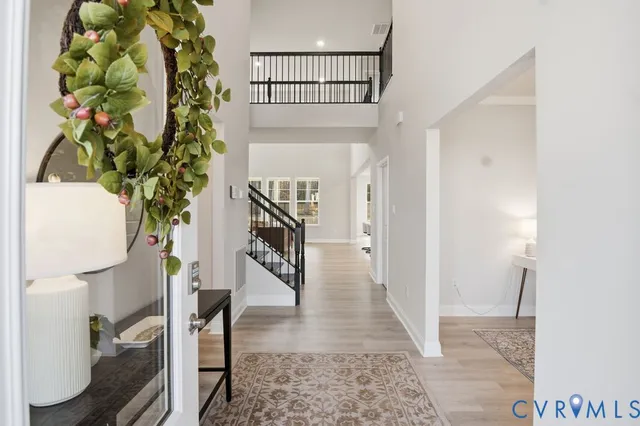 a view of entryway with wooden floor
