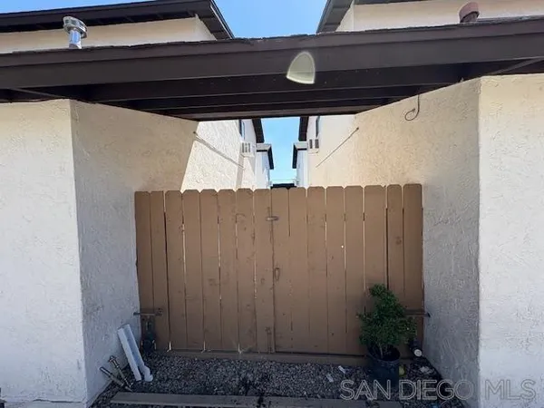a view of a backyard with trees