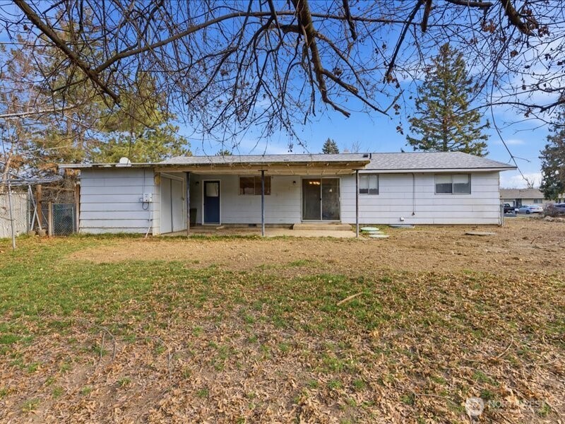 702 West Ridge Drive Omak, WA 98841 - Photo 21 of 26 a front view of a house with a garden