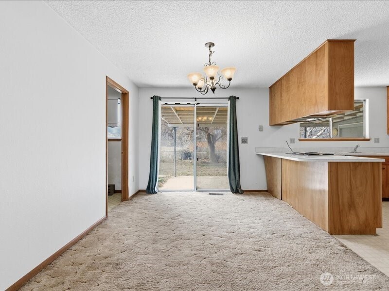 702 West Ridge Drive Omak, WA 98841 - Photo 6 of 26 a view of a kitchen with granite countertop cabinets and a sink