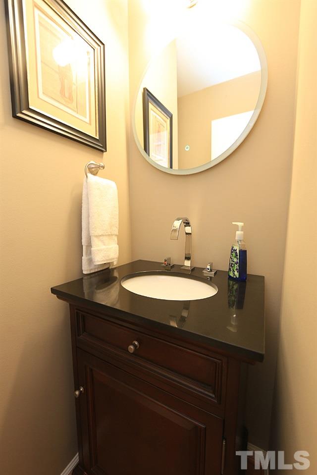 5413 Echo Ridge Road Raleigh, NC 27612 - Photo 17 of 29 Custom and modern 1/2 bath on main level