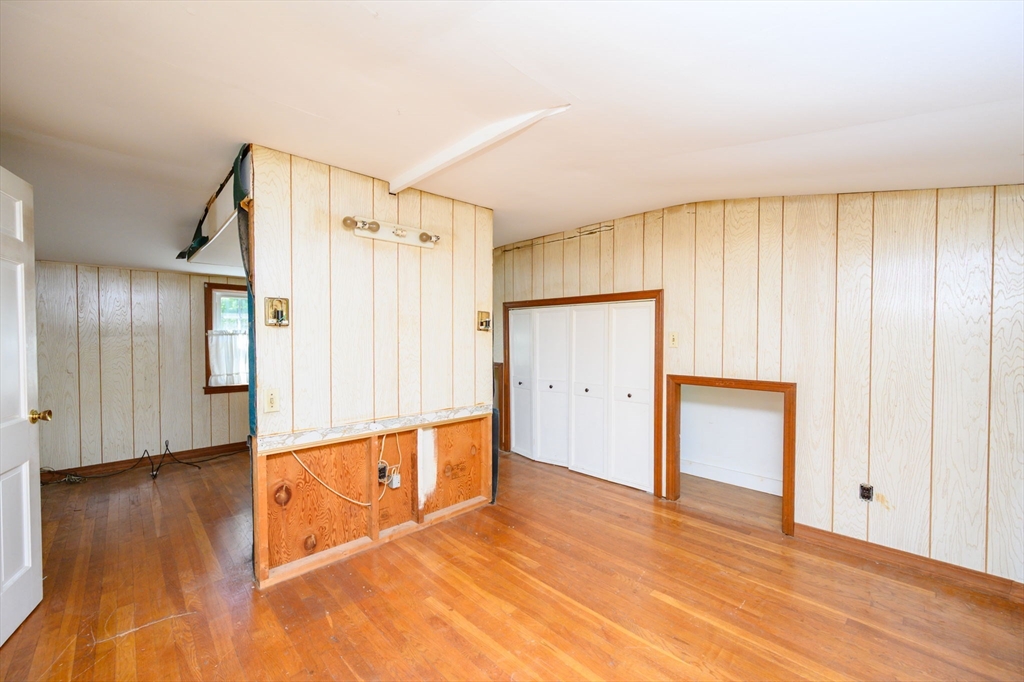 8 Walnut Street Whitman, MA 02382 - Photo 12 of 17 a view of an empty room with wooden floor and a window