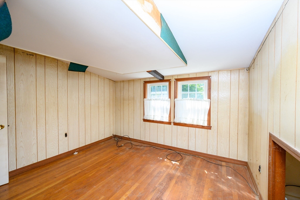 8 Walnut Street Whitman, MA 02382 - Photo 13 of 17 a view of an empty room with wooden floor and a window