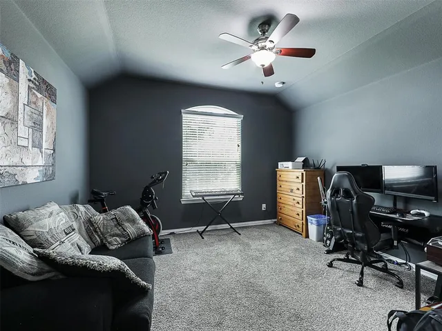 a bedroom with bed and a window