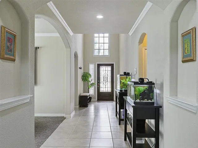 a view of hallway with livingroom and furniture
