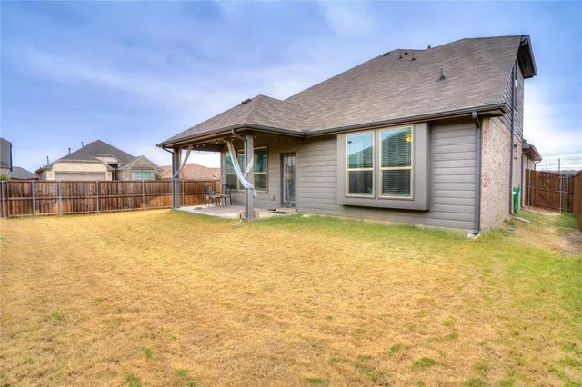 a house view with swimming pool in front of it